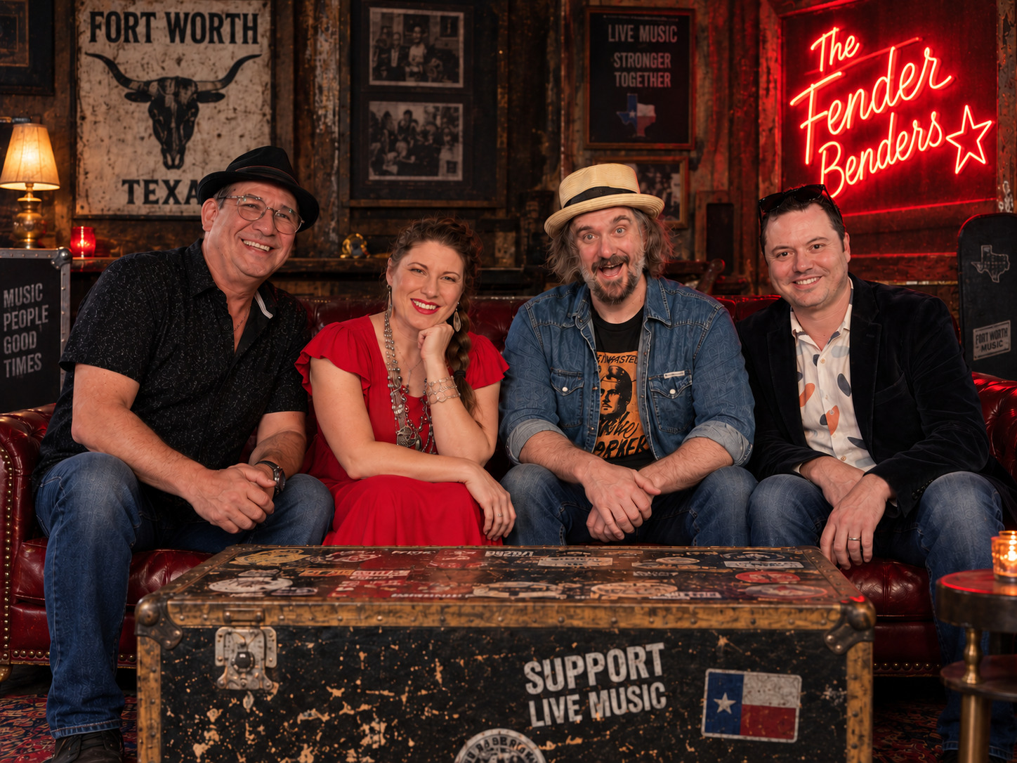 The four Fender Benders seated together in a relaxed lounge portrait